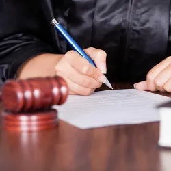 A judge signing a modification order